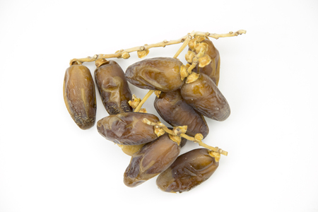 Dried date fruits on white background.の写真素材