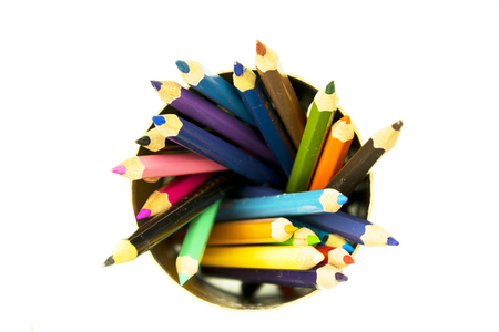 Spiral of colored pencils isolated on white.の写真素材