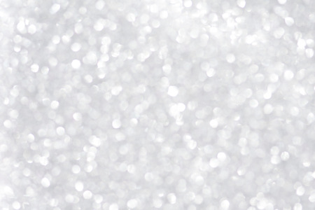 Abstract silver glitter Light blurred background.の写真素材