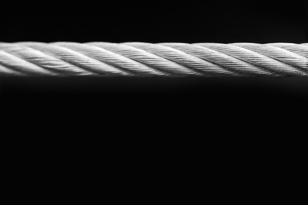 Silver detailed Metal Cable on black backgroundの写真素材