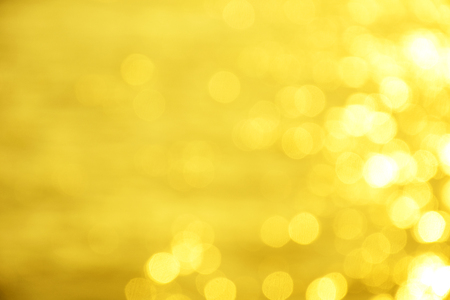 golden background of defocused abstract lights. golden bokeh lights.の写真素材