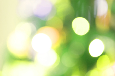 Defocused Bokeh twinkling lights Vintage background. Festive background with natural bokeh and bright lights.の写真素材