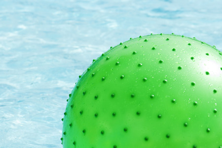 Beach Ball Floating in Swimming Poolの写真素材