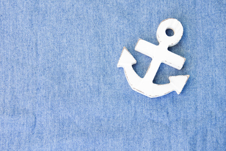 A white wood anchor on fabric for backgroundの写真素材