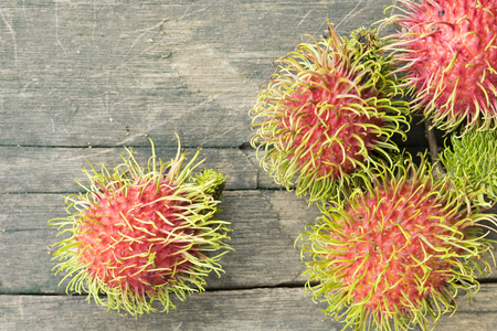Fresh rambutan on wood backgroundの写真素材