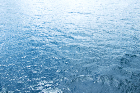 Blue sea surface with wavesの写真素材