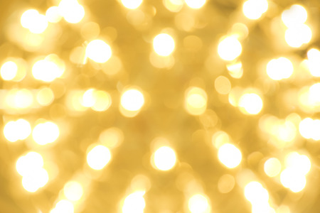 Beautiful abstract bokeh yellow lights over bright backgroundsの写真素材