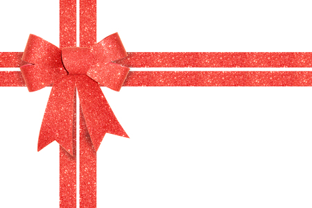 Shiny red Gift Bow with Ribbon isolated on white background.の写真素材