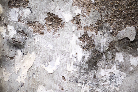 Layered wall erosion with bricks. Texture of an old brick wall.の写真素材