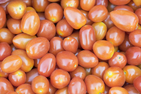 fresh red tomatoes in marketの写真素材