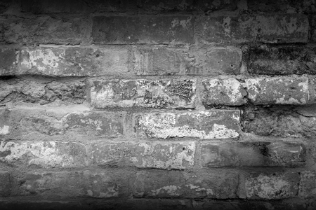 Old brick wall background. Grunge texture. Black wallpaper. Dark surfaceの写真素材