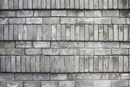 Old brick wall background. Grunge texture. Black wallpaper. Dark surface