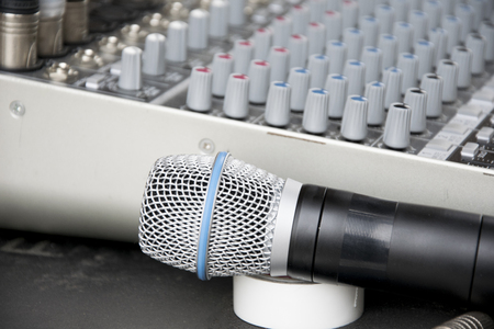 Close up audio control desk and microphone.の写真素材