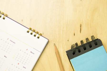 pencil with notebook and calendar on work space wooden. top view, flat lay concept.の写真素材