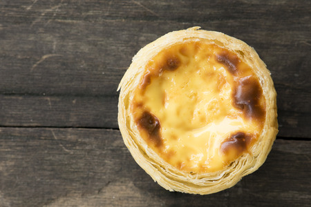 egg tart on wooden table background. Top view.の写真素材