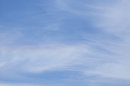 clouds and rainbow in the blue skyの写真素材