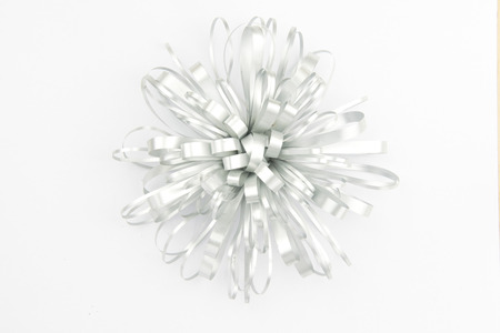 Beautiful silver bow on white backgroundの写真素材