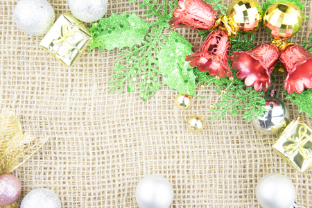 Christmas decoration on brown sackcloth backgroundの写真素材