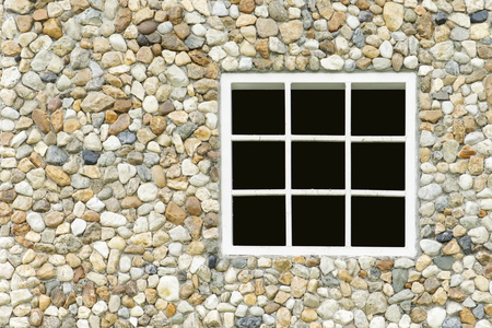 rock wall with white window backgroundの写真素材