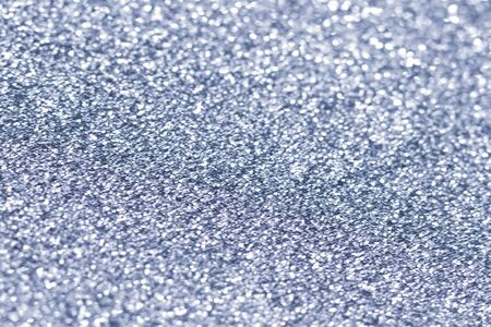 Sillver bokeh texture. Festive glitter background with defocused lights.の写真素材