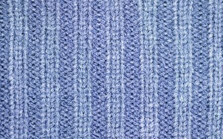 Background of the wool yarn. Woollen fabric texture closeup. Textile texture background. Detailed warm yarn background.の写真素材