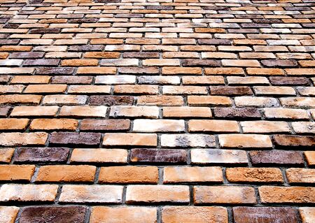 Bottom view brick wall texture and background.の写真素材