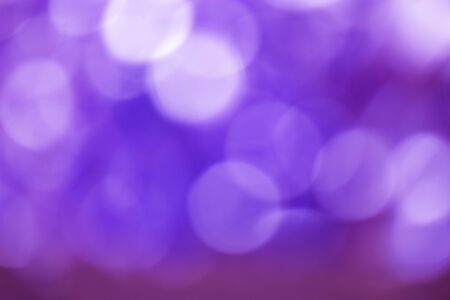 Defocused Bokeh twinkling lights Vintage background. Festive background with natural bokeh and bright lights.の写真素材