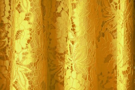Lace fabric background, glod lace fabricの写真素材