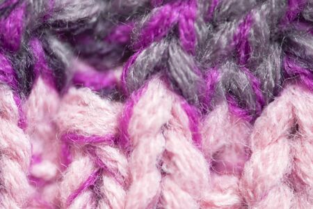 Background of the wool yarn. Woolen fabric texture closeup. Textile texture background. Detailed warm yarn background.の写真素材