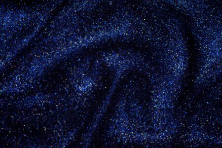 Fantasy bokeh glitter dust on dark magic background.の写真素材