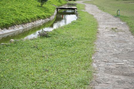 stone path to and small stream.の写真素材