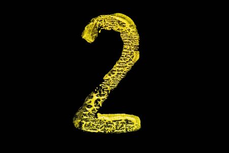 Golden number 2 isolated on black backgroundの写真素材