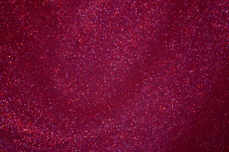 Red Golden glitter dust bokeh background.の写真素材