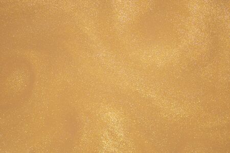 Golden glitter dust luxury  texture background.の写真素材