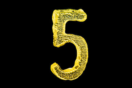 Golden number 5 isolated on black backgroundの写真素材