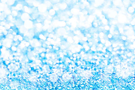 Blue bokeh texture. Festive glitter background with defocused lightsの写真素材