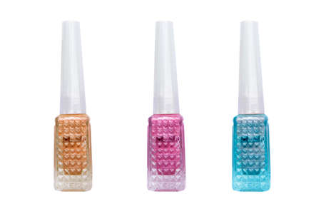 colorful glitter nail polish on a white background.の写真素材