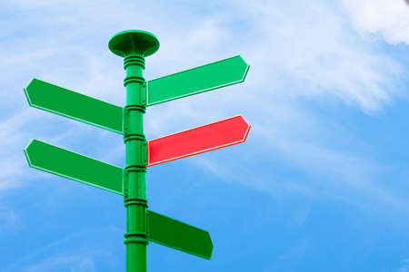 Blank direction sign with 5 arrowsn sky background.の写真素材