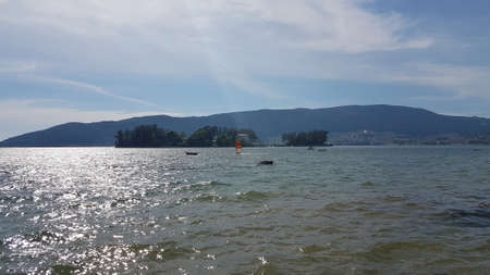 Windsurfing in the RÃ­a de Vigo bay, with San SimÃ³n island in the backgroundの写真素材