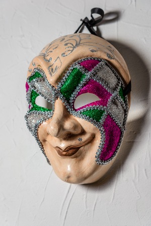 Sinister Joker mask n white wallの写真素材