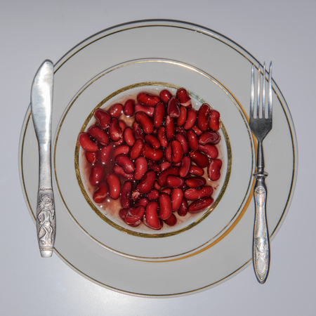 beans on a plate. fork knifeの写真素材