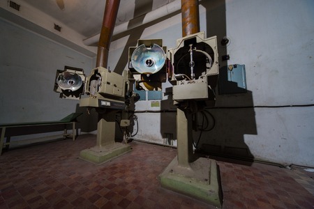 Angled 35mm movie projector images in projecting roomの写真素材