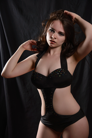 young  girl in body isolated on a black backgroundの写真素材