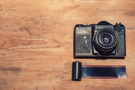 Vintage camera on wooden background
