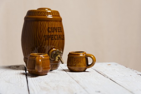 ceramic barrel and mug on the white tableの写真素材