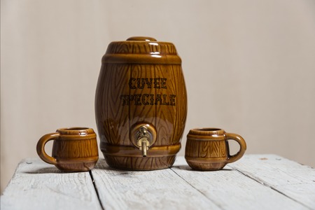 ceramic barrel and mug on the white tableの写真素材