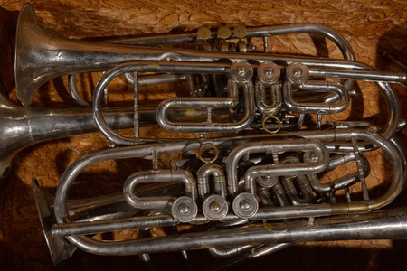 Fragment four  old broken trumpet  in box.の写真素材
