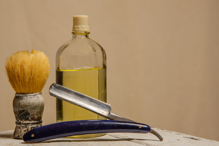 A sharp straight razor, brush and cologne aftershaveの写真素材