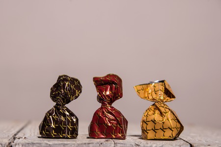 set of 3 different chocolates on gray background