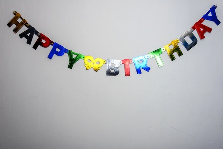 white wall and an inscription happy birthdayの写真素材